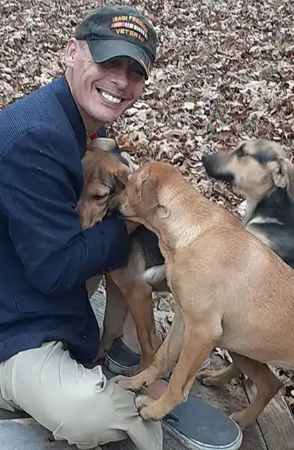 Veteran David Haave training service dogs for Veterans returning home with PTSD, Dixon, MO, USA. -- David Haave